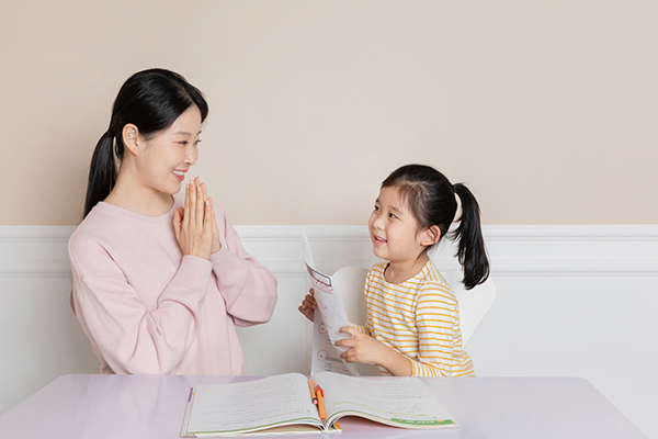 Nanny teaching a child